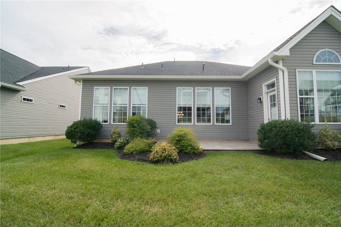 4097 Rutz Lane Allentown, PA 18104 - Photo 48 of 59 Neat siding and large multi-pane windows overlook a green lawn and tidy landscape beds.