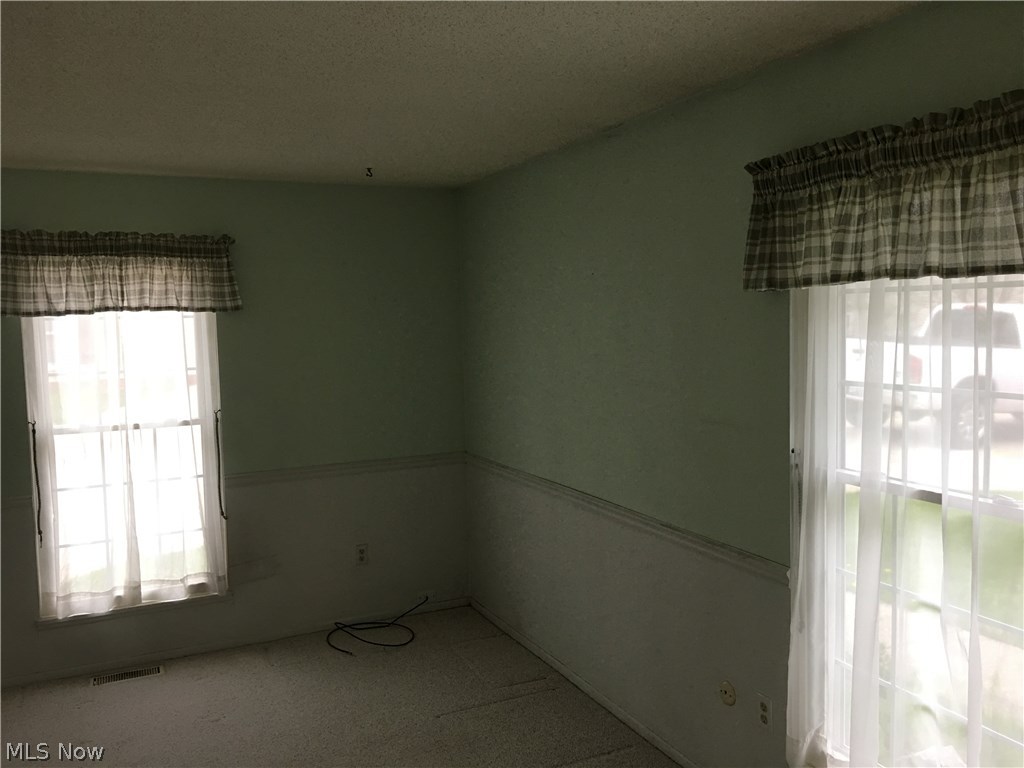 4940 Friar Road, Unit D Stow, OH 44224 - Photo 9 of 23 To the right as you enter the condo is the Family Room/Master Bedroom possibility. Most of these units have converted this to the main floor living space to accommodate the desire for 1 floor living space. Adjoining this room is a full bath.