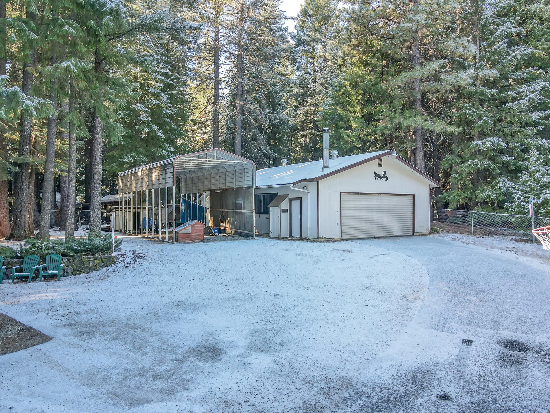 9390 Thatcher Mill Road Shingletown, CA 96088 - Photo 33 of 39 a view of a house with a yard and large trees