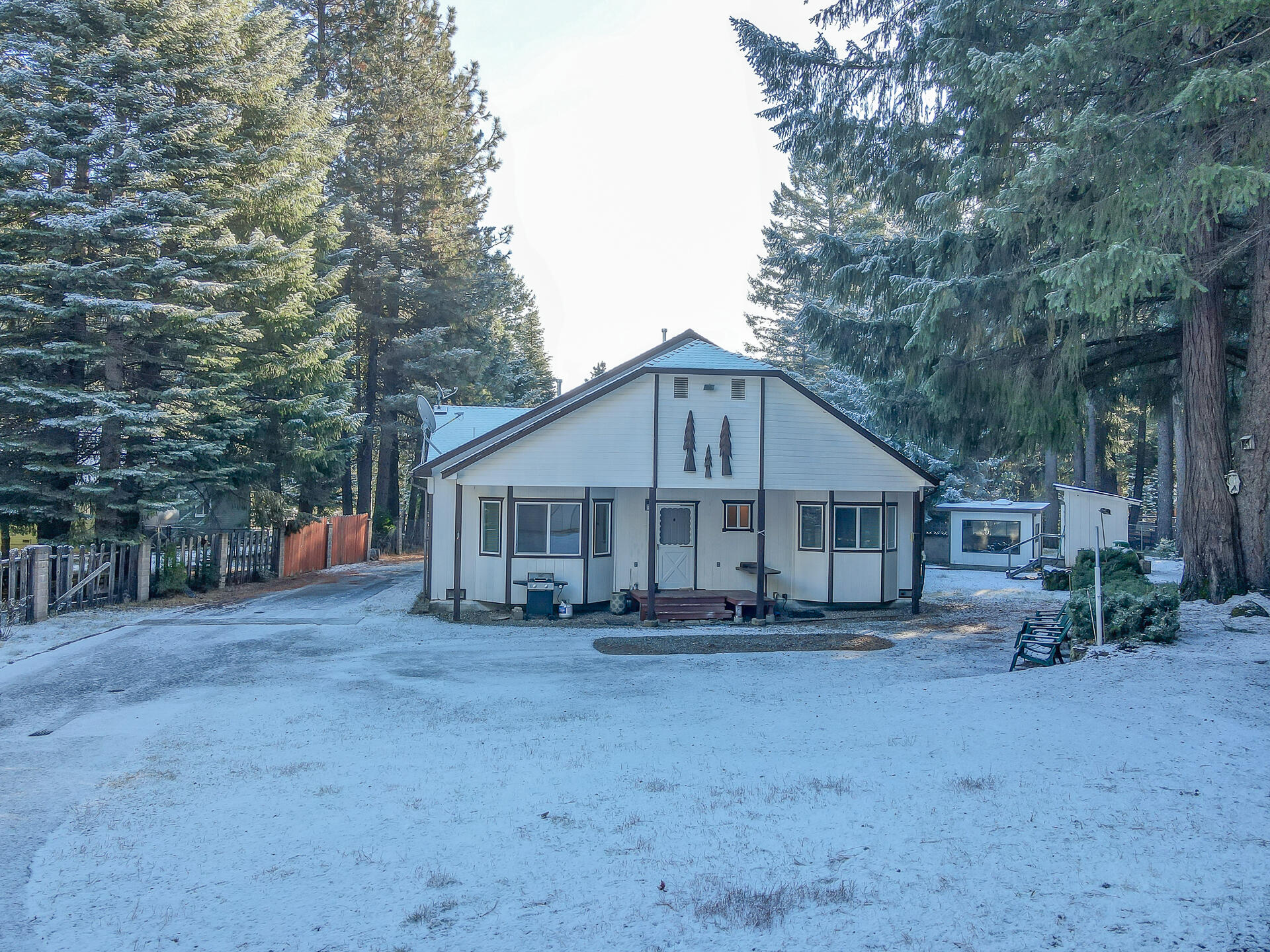 9390 Thatcher Mill Road Shingletown, CA 96088 - Photo 36 of 39 a view of a house with a yard