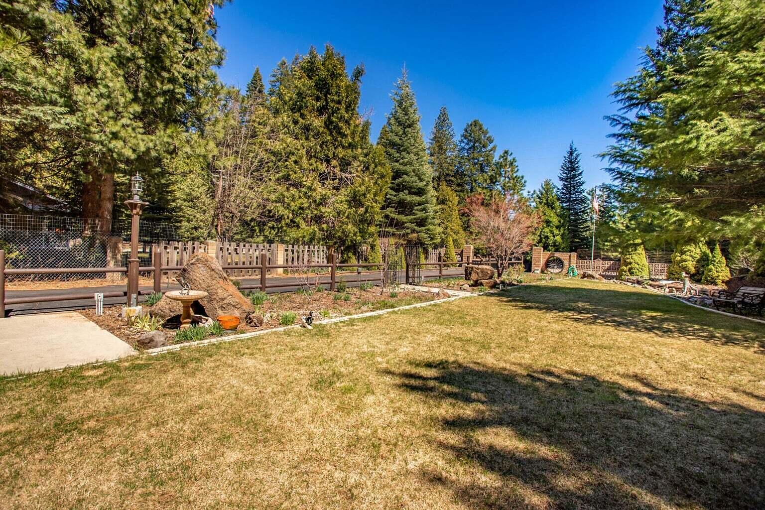 9390 Thatcher Mill Road Shingletown, CA 96088 - Photo 39 of 39 a view of a swimming pool with an outdoor space and seating area