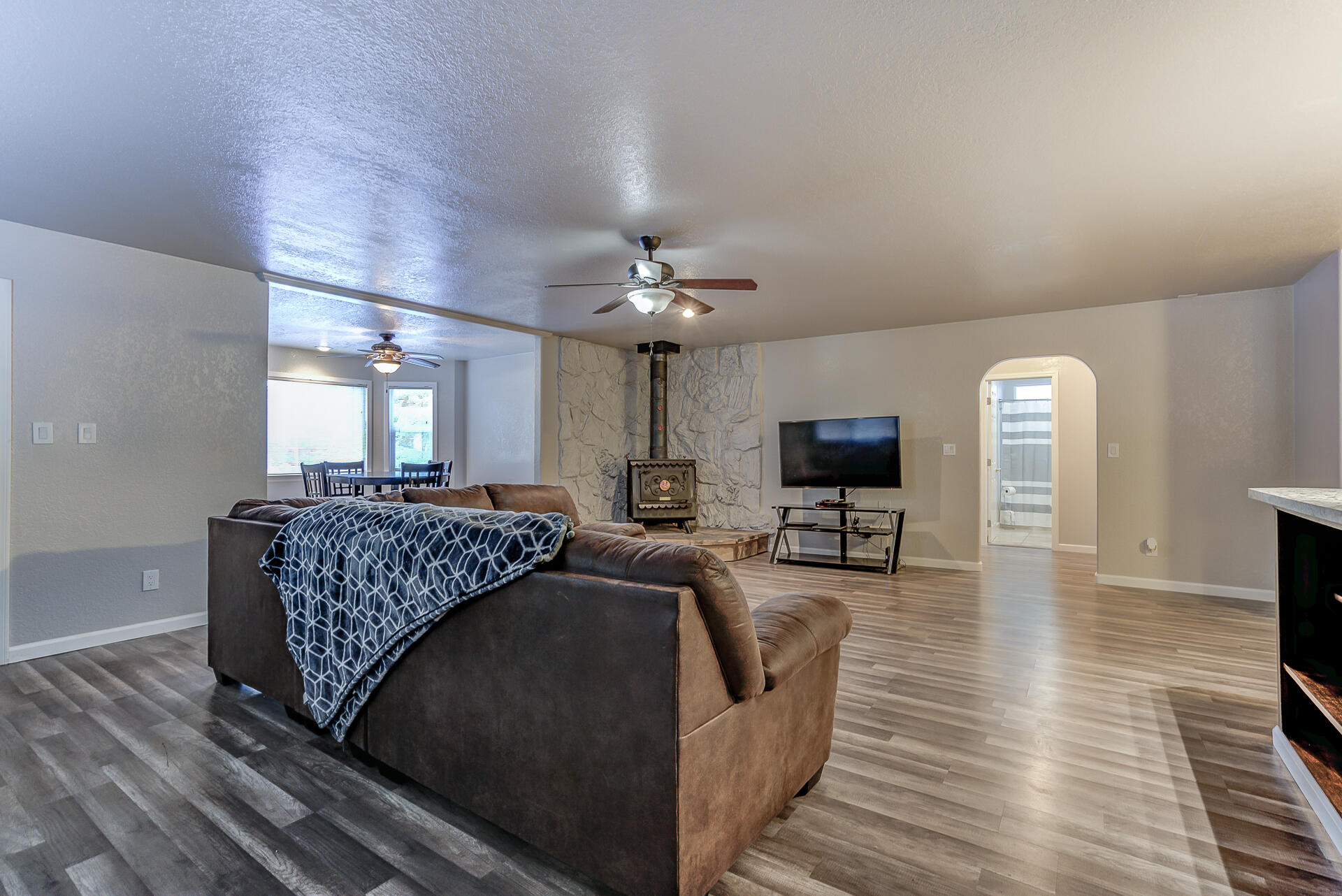 9390 Thatcher Mill Road Shingletown, CA 96088 - Photo 5 of 39 a living room with furniture and a flat screen tv