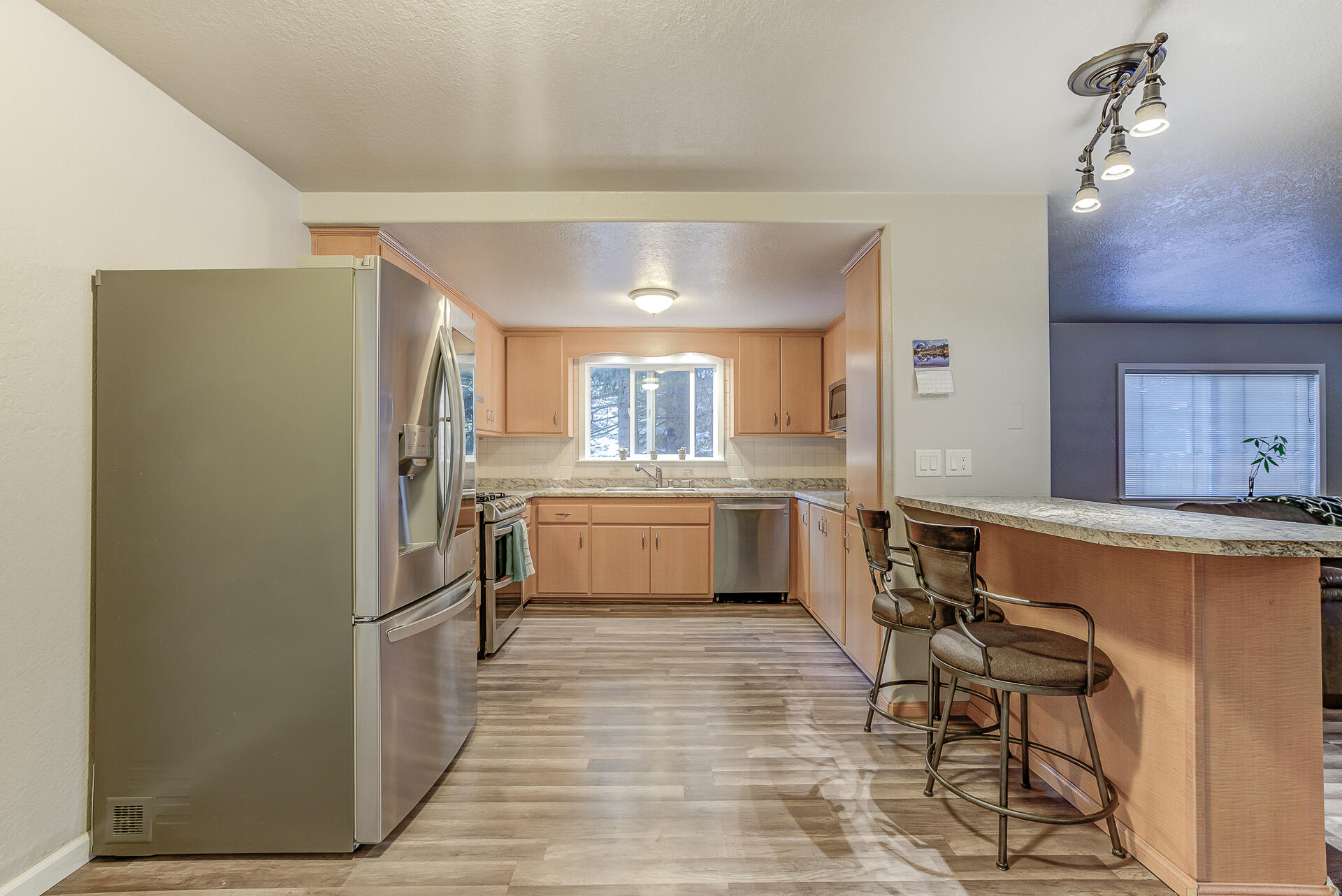 9390 Thatcher Mill Road Shingletown, CA 96088 - Photo 10 of 39 a kitchen with cabinets and wooden floor