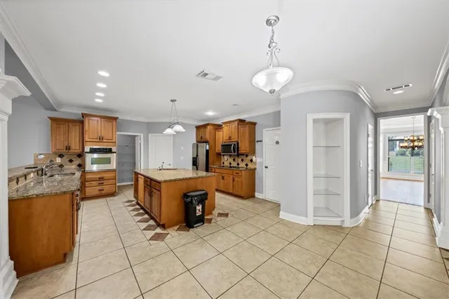 a kitchen with granite countertop a sink and a granite counter top