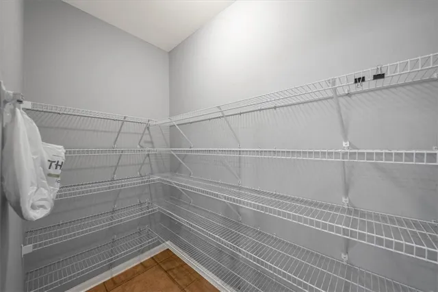 a view of a room with wooden floor and staircase