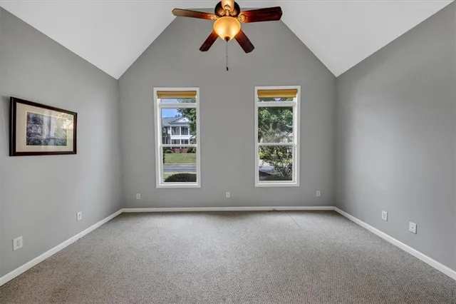 a kitchen with granite countertop a stove and a refrigerator