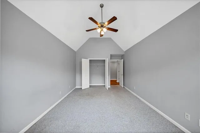 a bathroom with a granite countertop sink a mirror and a shower