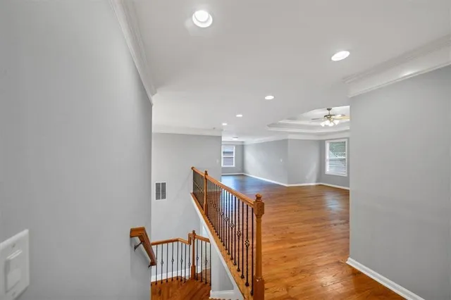 a view of a livingroom with a ceiling fan and window