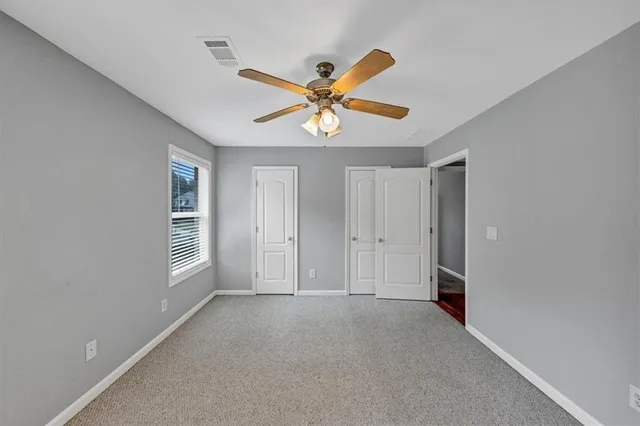 a aerial view of a house with a yard