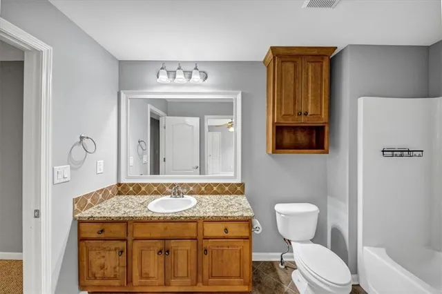 a picture of a bathroom with a shower