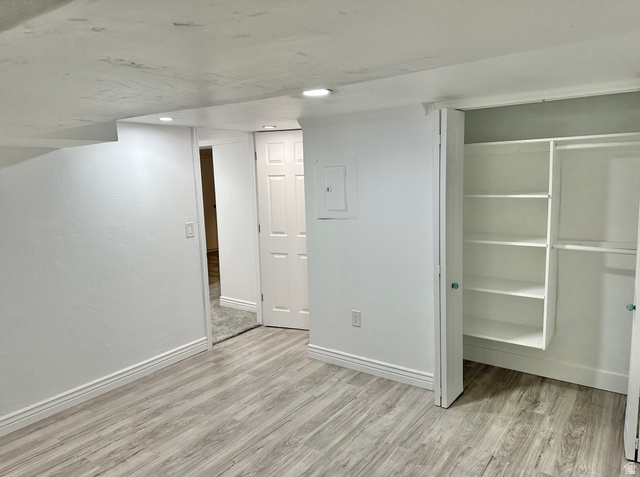 1050 West 100 North Provo, UT 84601 - Photo 14 of 16 Room featuring wood-finish flooring, recessed lighting, and white baseboards