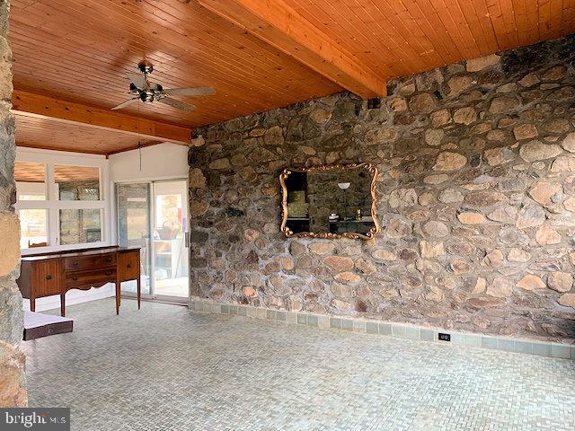 20070 Airmont Road Round Hill, VA 20141 - Photo 3 of 18 Great room stone wall and tile floor
