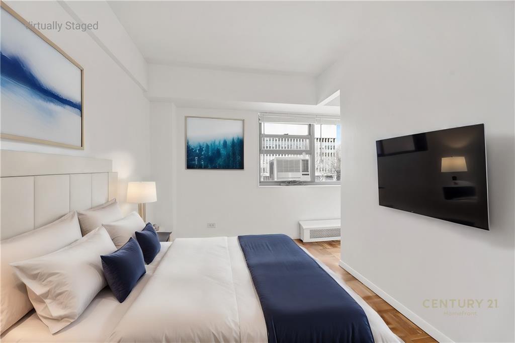 225 Adams Street, Unit 4E Brooklyn, NY 11201 - Photo 14 of 15 a bedroom with a bed and a flat screen tv