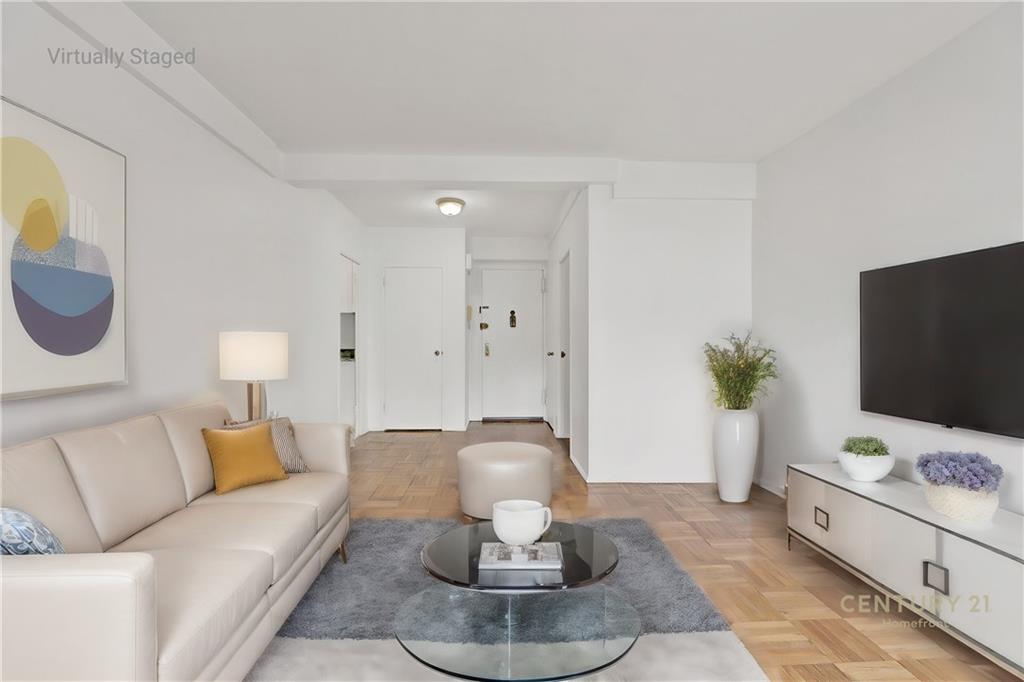 225 Adams Street, Unit 4E Brooklyn, NY 11201 - Photo 9 of 15 a living room with furniture and a flat screen tv