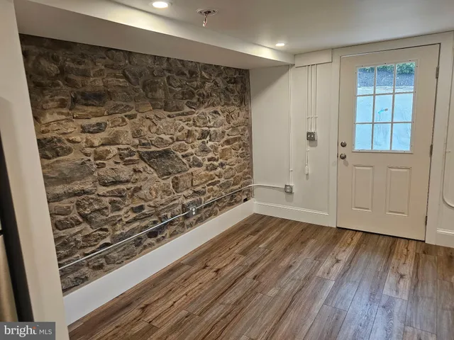 a view of wooden floor in an empty room