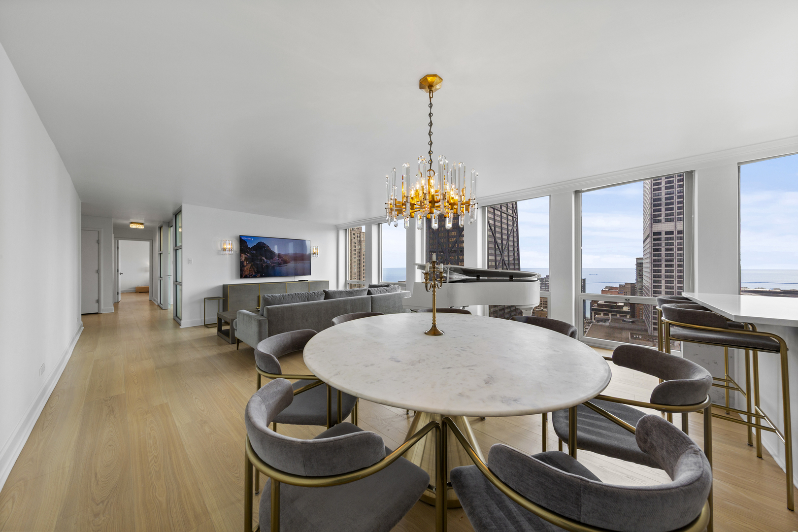 111 East Chestnut Street, Unit 38C Chicago, IL 60611 - Photo 13 of 39 a view of a dining room with furniture window and outside view