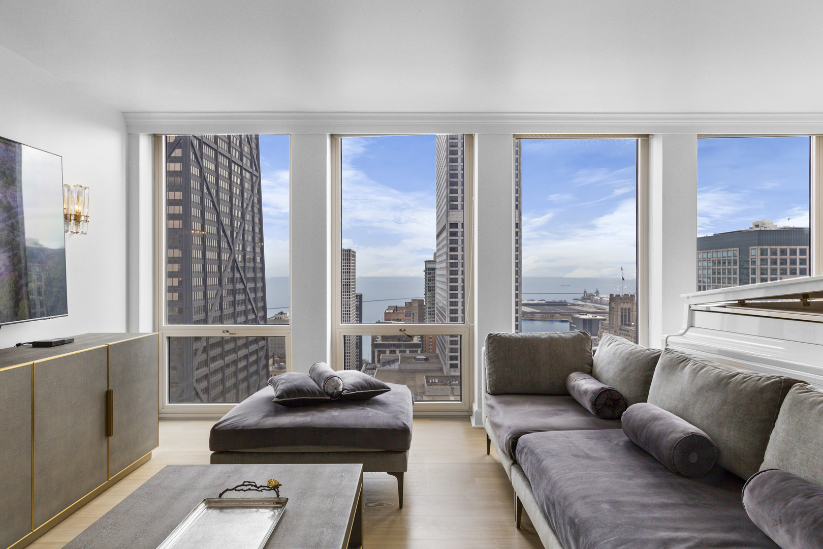 111 East Chestnut Street, Unit 38C Chicago, IL 60611 - Photo 14 of 39 a living room with furniture and a large window