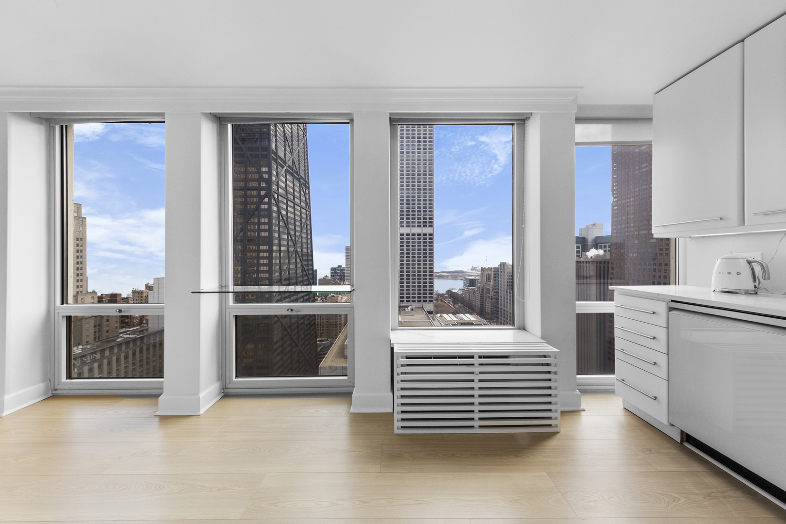 111 East Chestnut Street, Unit 38C Chicago, IL 60611 - Photo 26 of 39 a room with stairs and a large window