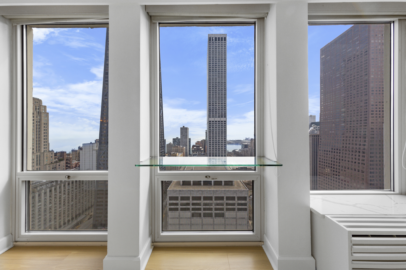 111 East Chestnut Street, Unit 38C Chicago, IL 60611 - Photo 27 of 39 a view of a glass door and a window
