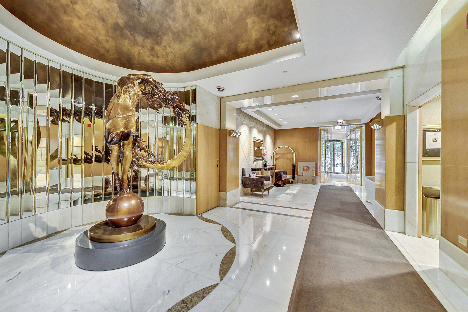 111 East Chestnut Street, Unit 38C Chicago, IL 60611 - Photo 38 of 39 a lobby with furniture and floor to ceiling window