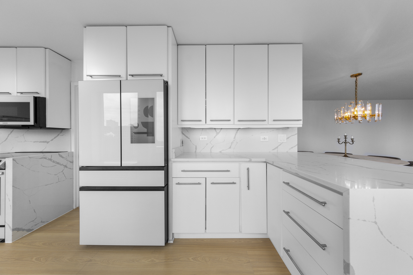 111 East Chestnut Street, Unit 38C Chicago, IL 60611 - Photo 9 of 39 a kitchen with appliances cabinets and a sink