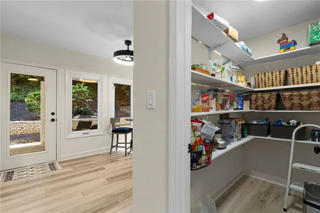 a view of a play room with furniture and toys