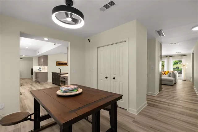 a view of a dining room with furniture and wooden floor