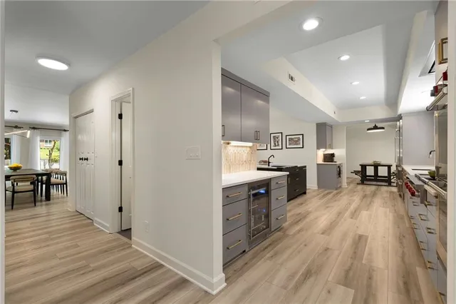 a large kitchen with a table and chairs in it