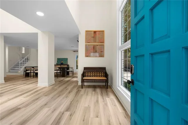 a view of a hallway with a furniture and a window