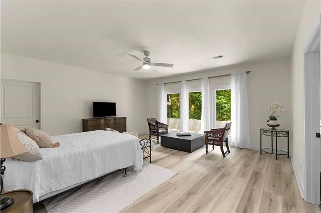 a bedroom with a bed and a couch