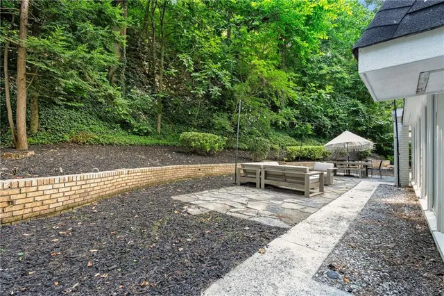 a view of a outdoor space with a patio and a yard