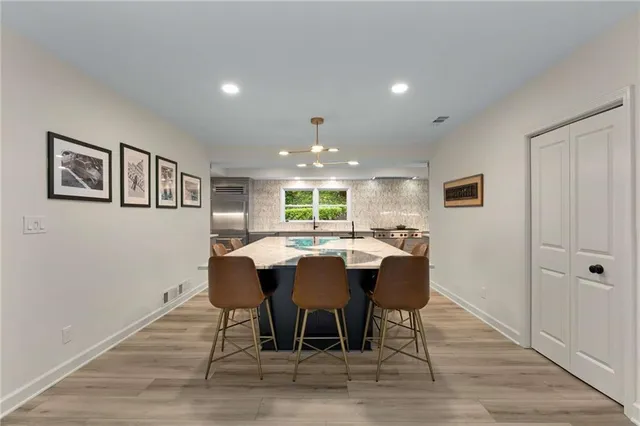 a view of a dining room with furniture and wooden floor