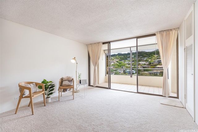 a view of workspace with furniture and a window
