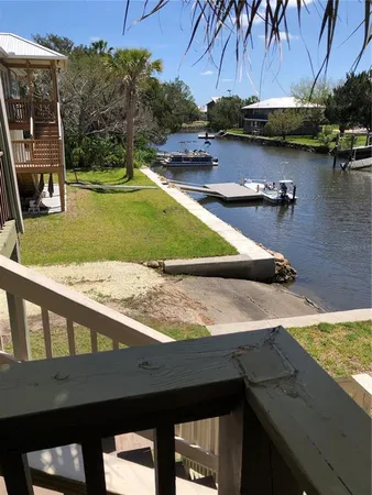 a view of a swimming pool with a yard