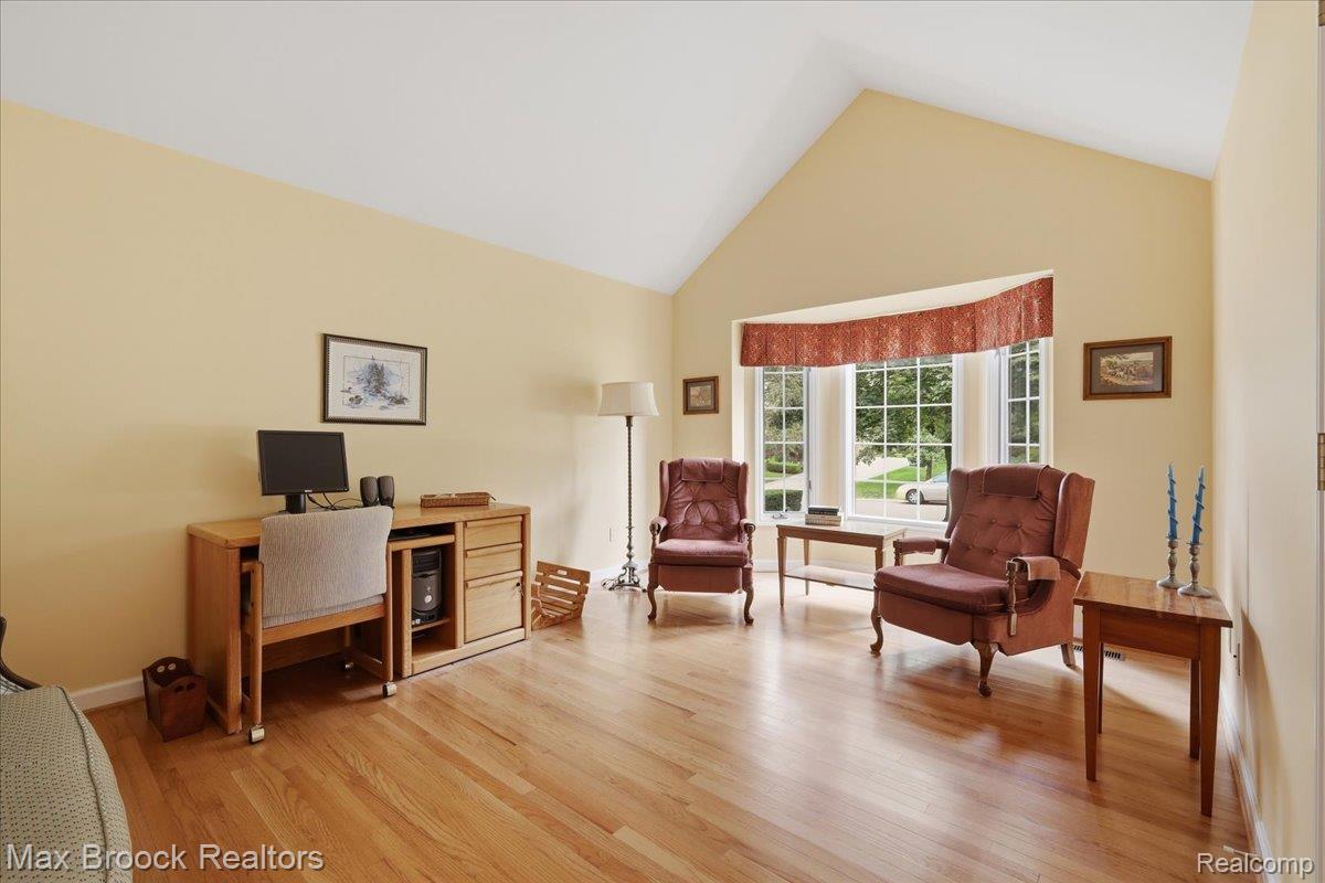 1731 Rico Road Commerce Township, MI 48382 - Photo 8 of 48 Vaulted ceilings, wood-finish flooring, and a bay window with natural light