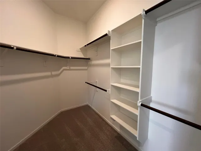 a view of an empty walk in closet