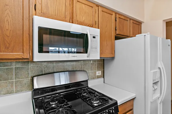 a kitchen with a stove and a microwave