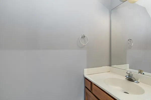 a bathroom with a sink and vanity