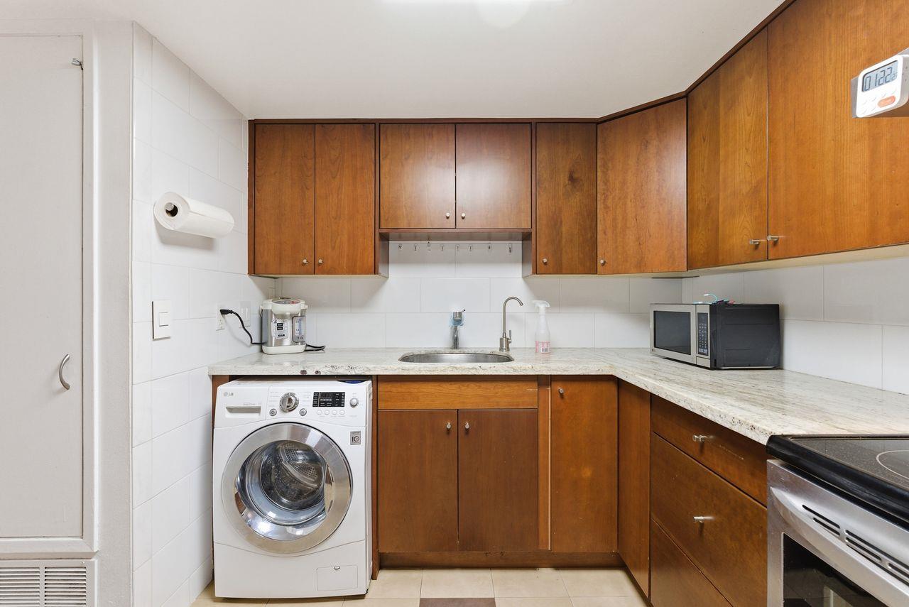 5561 Roundtree Common Fremont, CA 94538 - Photo 7 of 29 a kitchen with a sink a stove and cabinets