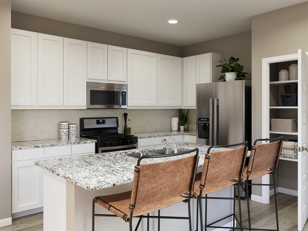 5024 Cervinae Road Crowley, TX 76036 - Photo 22 of 38 a kitchen with stainless steel appliances kitchen island granite countertop a table chairs microwave and sink