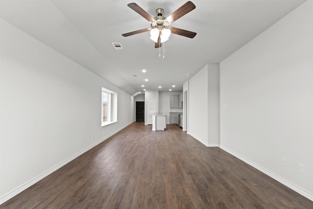 5024 Cervinae Road Crowley, TX 76036 - Photo 6 of 38 a view of a livingroom with a window and wooden floor