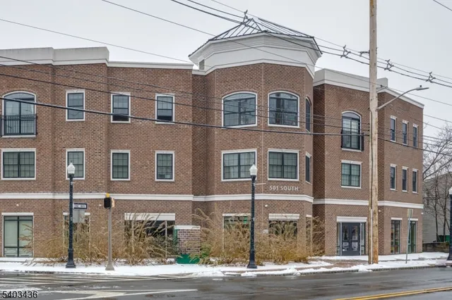 a front view of a building with a street