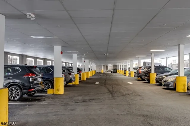 a view of parking garage with cars