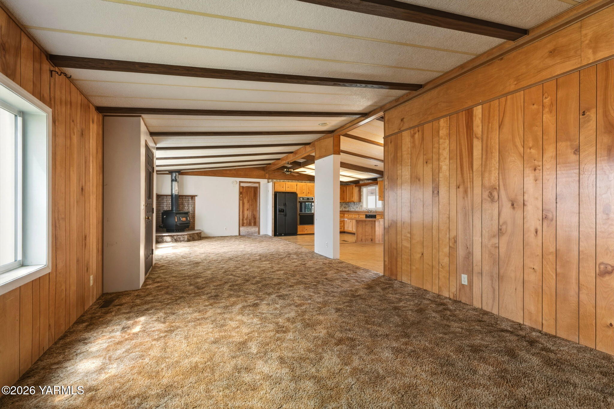 171 Gopher Road Selah, WA 98942 - Photo 8 of 24 a view of a room with a wooden walls and stairs