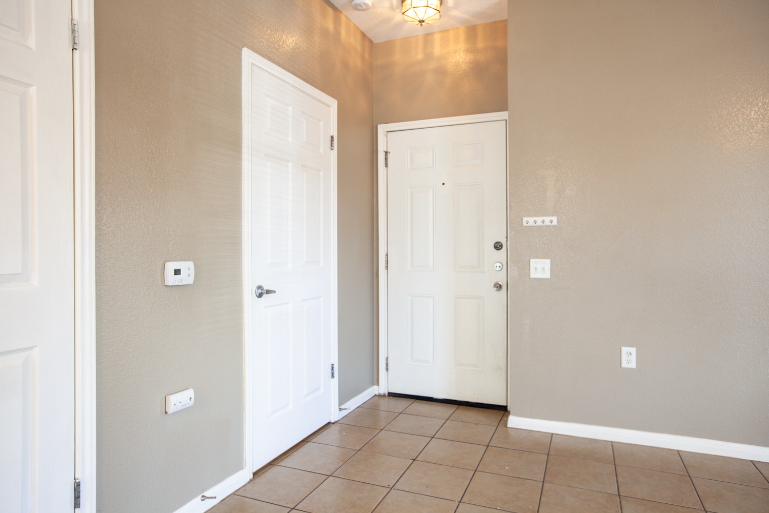 2326 Webberville Road, Unit B Austin, TX 78702 - Photo 3 of 15 Entryway featuring tile flooring and neutral wall tones