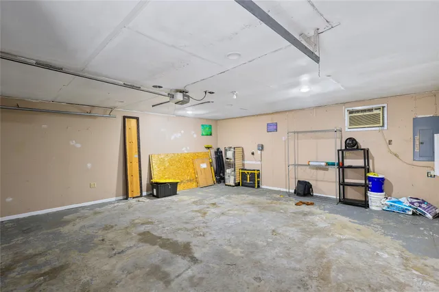 a view of a room with air conditioner duct and materials on floor