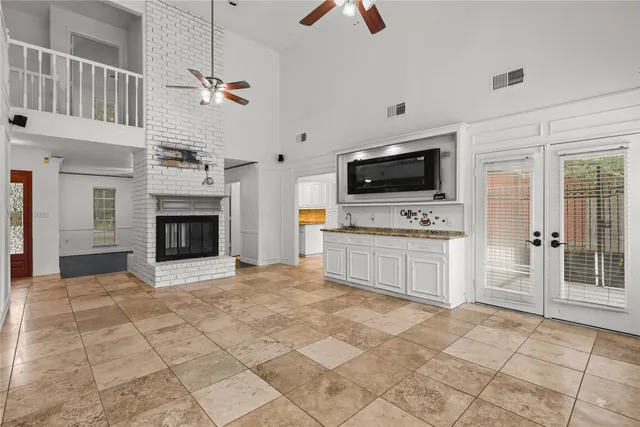 a view of living room with furniture and fireplace