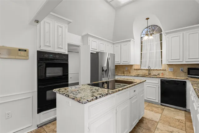 a kitchen with a sink stove and refrigerator