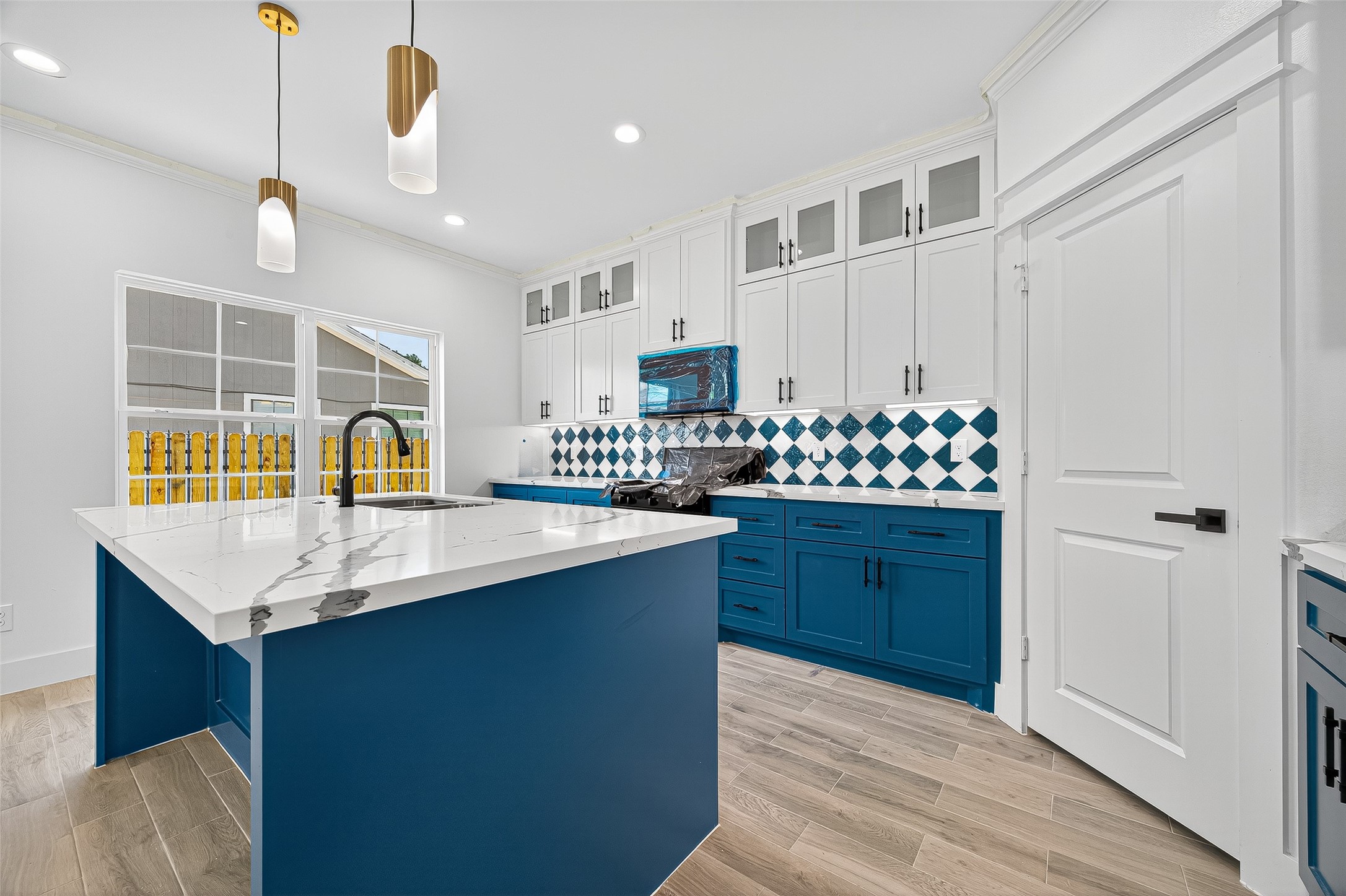 3168 Golfcrest Houston, TX 77087 - Photo 5 of 14 a kitchen with a sink stove and cabinets