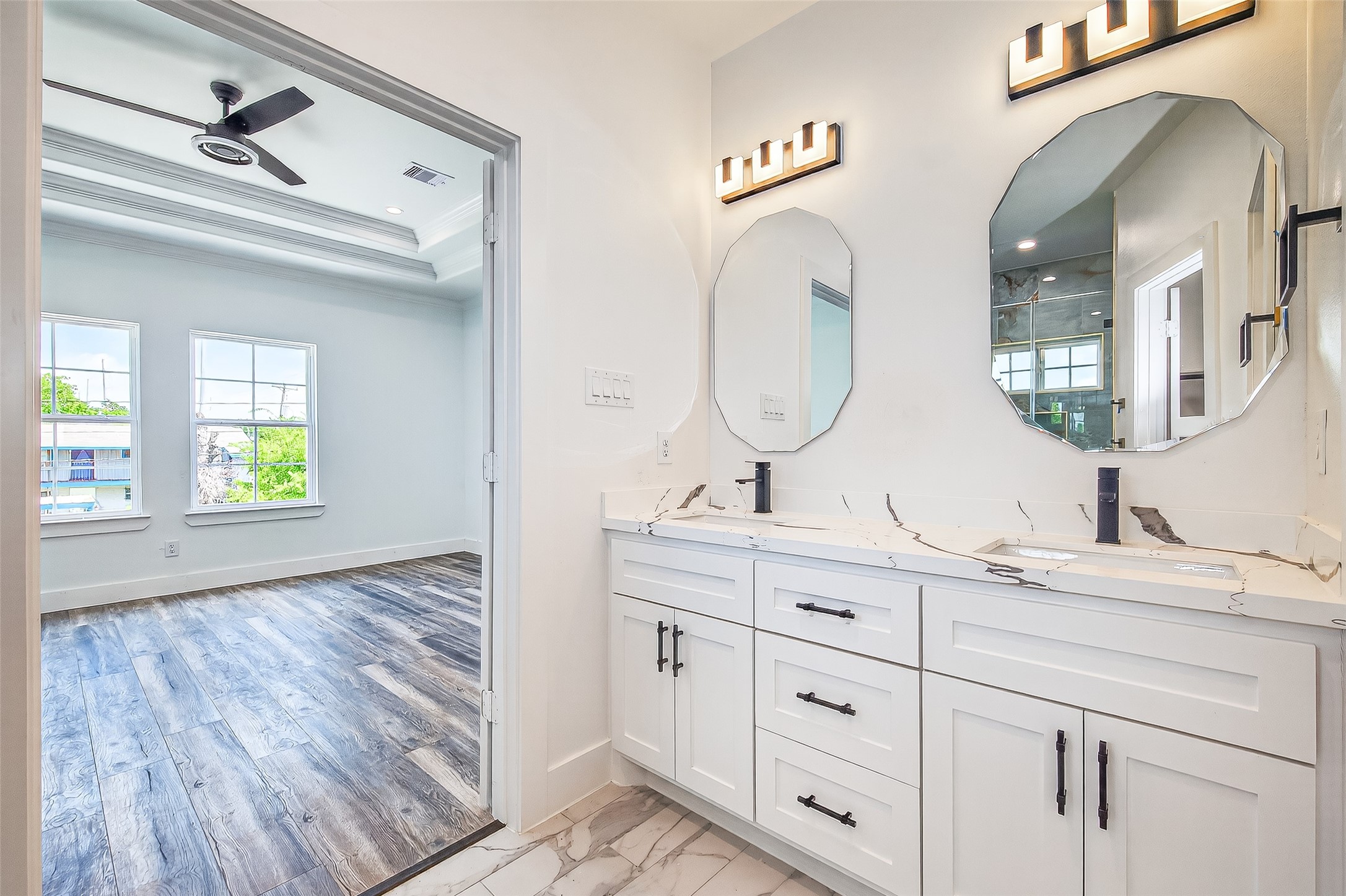 3168 Golfcrest Houston, TX 77087 - Photo 9 of 14 a bathroom with a double vanity sink and a mirror